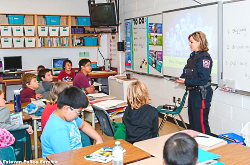 Photo of Estevan Police Service Constable Danielle Stephanie visiting with local students (courtesy of Constable Danielle Stephanie)